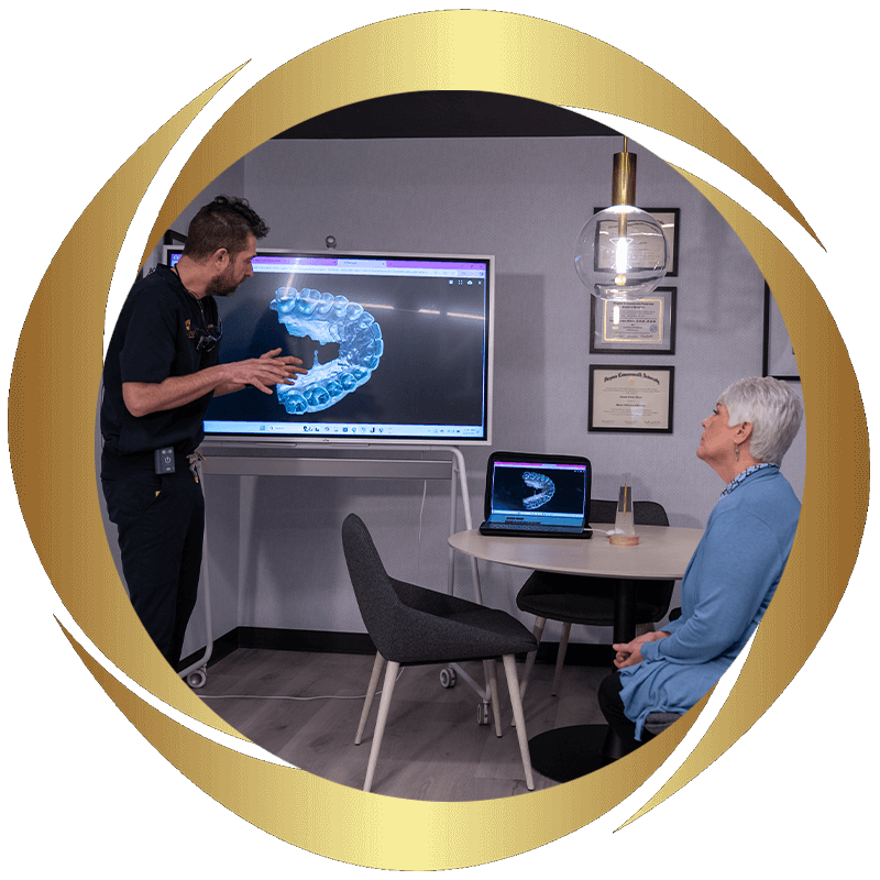 Dentist going over 3d scan of patients teeth