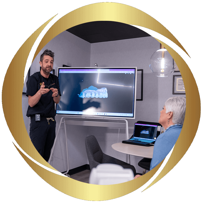 doctor going over 3d scan of patients teeth